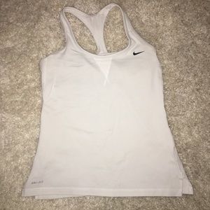 Pink and white nike tank tops.